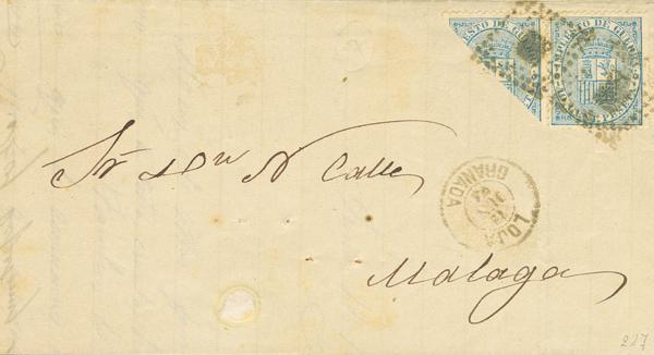 376 - <i class="far fa-envelope"></i>  142(2). 1874. 10 cts azul, pareja, un sello BISECTADO para ser utilizado como 5 cts. LOJA (GRANADA) a MALAGA. MAGNIFICA Y EXTRAORDINARIAMENTE RARA, NO MAS DE DOS O TRES CONOCIDAS. Cert. GRAUS. - 475€
